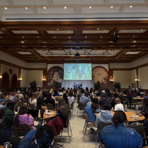 Alie speaking to the audience.